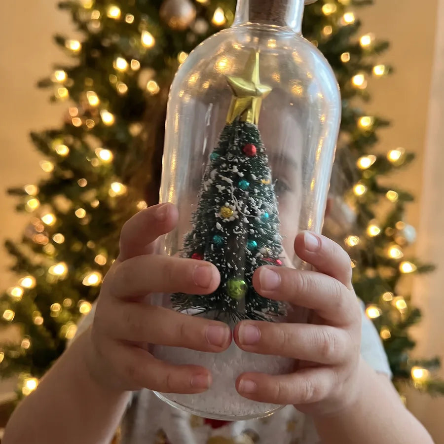 A child holding the bottle
